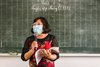 Vietnam: Lehrerin vor Tafel